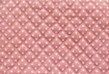 White Polka dot over pink fabric table texture background