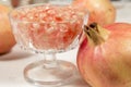 White pomegranate beside a crystal goblet full of grains