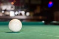 A white pool ball on a pool table. Royalty Free Stock Photo