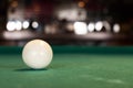 A white pool ball on a pool table. Royalty Free Stock Photo