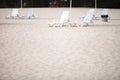 White pool chairs on sand beach Royalty Free Stock Photo