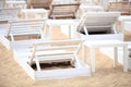 White pool chairs on sand beach Royalty Free Stock Photo