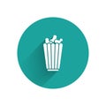 White Popcorn in cardboard box icon isolated with long shadow. Popcorn bucket box. Green circle button. Vector