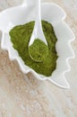 White porcelain bowl with matcha green tea powder. Natural beauty treatment and spa. Homemade matcha mask recipe. Top view Royalty Free Stock Photo