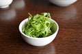 White porcelain bowl with rocket herb