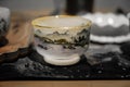 White porcelain cup with hand painted landscape