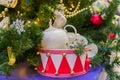 White porcelain mice in a red toy drum. Christmas decorations. Symbol of the year 2020