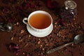 White porcelain mug on a saucer with herbal tea