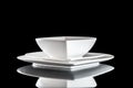 White porcelain plate on table. Dinner background. Empty round round isolated on black background. Restaurant kitchen Royalty Free Stock Photo