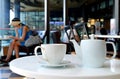 White porcelain tea set served on cafe`s round table Royalty Free Stock Photo