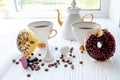 white porcelain teapot and cup on white wooden table on windowsill on sunny day. Tea after game. Chess pieces near Royalty Free Stock Photo