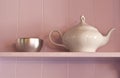 White porcelain teapot and metal sugar bowl on a p Royalty Free Stock Photo