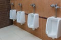 White porcelain urinals in public toilet