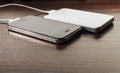 White portable power bank and mobile phone