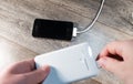 White portable power bank and mobile phone