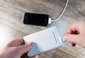 White portable power bank and mobile phone