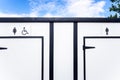 White portable toilets with space for women, men and disabled people