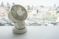 White portable USB desktop fan on office table