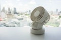 White portable USB desktop fan on office table