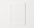 White portrait frame with mat mockup on white wall, 3:4 ratio, 30x40 cm, 18x24`. empty poster frame mock up,. 3d rendering. Royalty Free Stock Photo