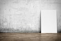 White poster on concrete wall and wood floor Royalty Free Stock Photo