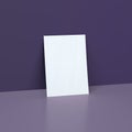 White Poster Mockups on a Dark Purple Background With Reflection.