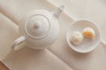 White pot of hot coffee  served with two small mooncake on table with vintage tone. Break times concept Royalty Free Stock Photo