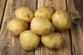 White potatoes on a wooden background.Fresh vegetables. Sale