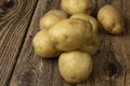White potatoes on a wooden background.Fresh vegetables. Sale