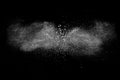 White powder explosion against dark background. Royalty Free Stock Photo