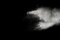 White powder explosion on black background.Stopping the movement of white powder on dark background. Royalty Free Stock Photo