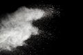 White powder explosion on black background.Stopping the movement of white powder on dark background. Royalty Free Stock Photo