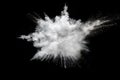 White powder explosion on black background.Stopping the movement of white powder on dark background. Royalty Free Stock Photo