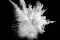 White powder explosion on black background.Stopping the movement of white powder on dark background. Royalty Free Stock Photo