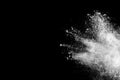 White powder explosion on black background.