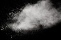 White powder explosion.Freeze motion of white dust particles on black background Royalty Free Stock Photo