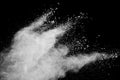 White powder explosion.Freeze motion of white dust particles on black background Royalty Free Stock Photo