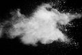 White powder explosion.Freeze motion of white dust particles on black background Royalty Free Stock Photo