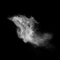 White powder explosion isolated on black