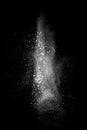 White powder explosion isolated on black