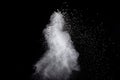 White powder explosion isolated on black background