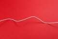White power cable socket on red background Royalty Free Stock Photo