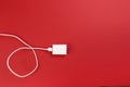 White power cable socket on red background Royalty Free Stock Photo