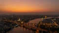 White Prayoon Pagoda, Memorial Bridge, and Phra Pok Klao Bridge with buildings and curve of Chao Phraya River at night. Urban city Royalty Free Stock Photo