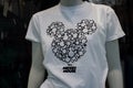 White printed tee-shirt with Mickey mouse symbols in a fashion store showroom