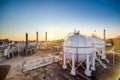 White propane tank with a fuel gas pipeline in the morning