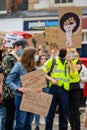 White protesters wear PPE Face Masks and hold homemade Black Lives Matter signs up high at a BLM protest