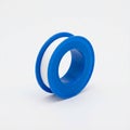 White PTFE Thread Seal Tape on Blue Plastic Spool Royalty Free Stock Photo