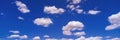 White puffy clouds and blue sky