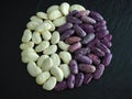 White and purple beans arranged in a yin/yang symbol Royalty Free Stock Photo